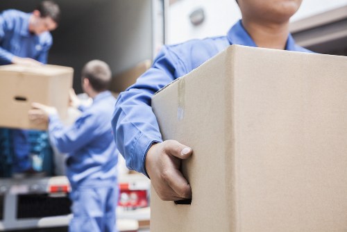 Removal team handling boxes and furniture during a Stratford home move