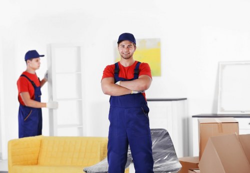 Man and van service loading items into a transport vehicle