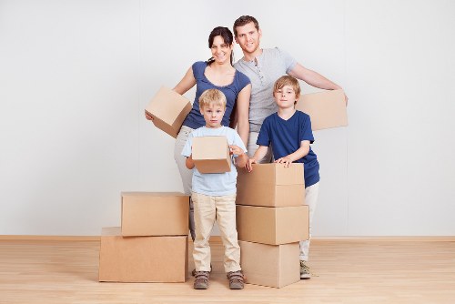 Careful wrapping and labelling boxes during a Stratford packing service