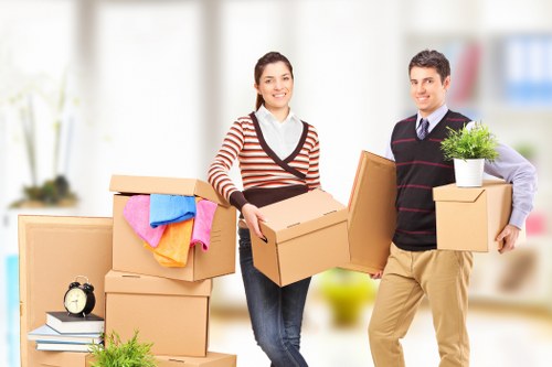 Team collecting bulky furniture from a Stratford flat building