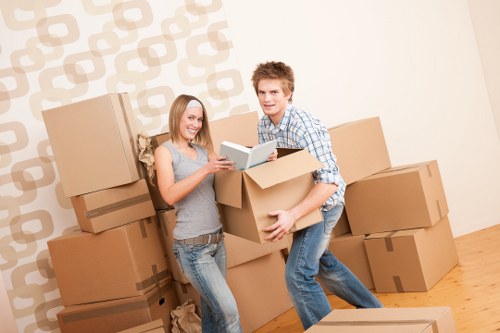 Packed boxes and furniture ready for a Stratford removal van