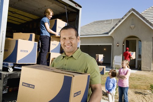 Removal crew loading boxes and furniture for a Stratford house relocation