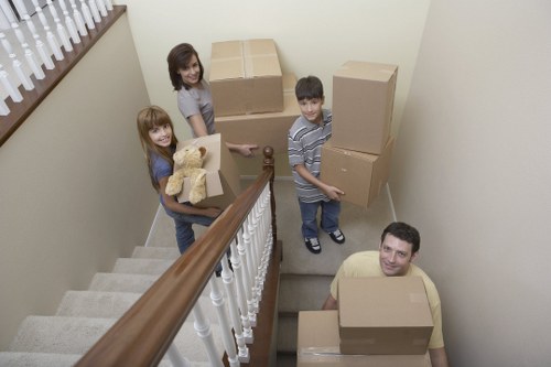 Professional team loading heavy furniture for a Stratford move
